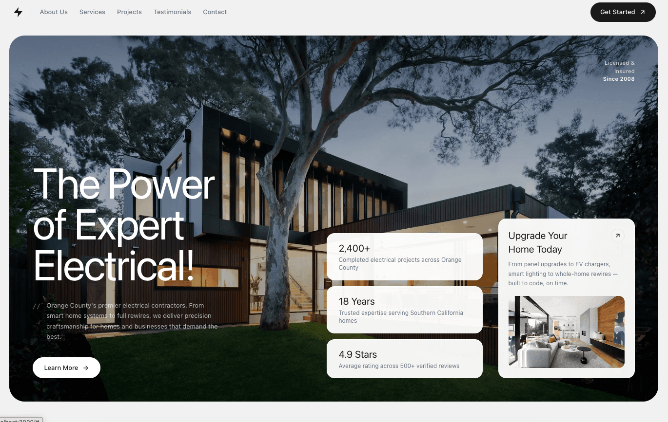 Home page of an electrical contractor site with a large dusk photo of a modern house, a bold headline, and three stat cards.
